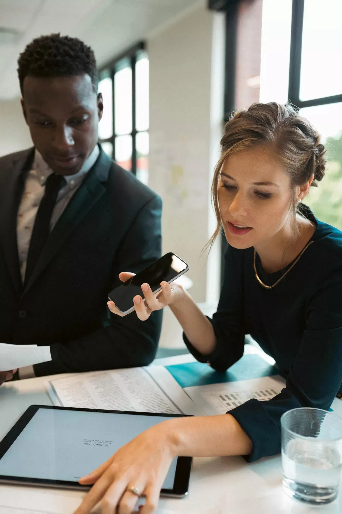 Two professionals working in an office setting.