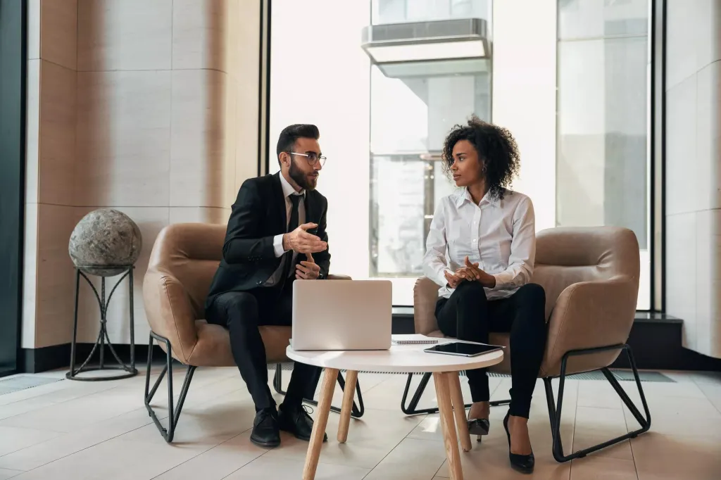 Man and woman meeting in an office setting.