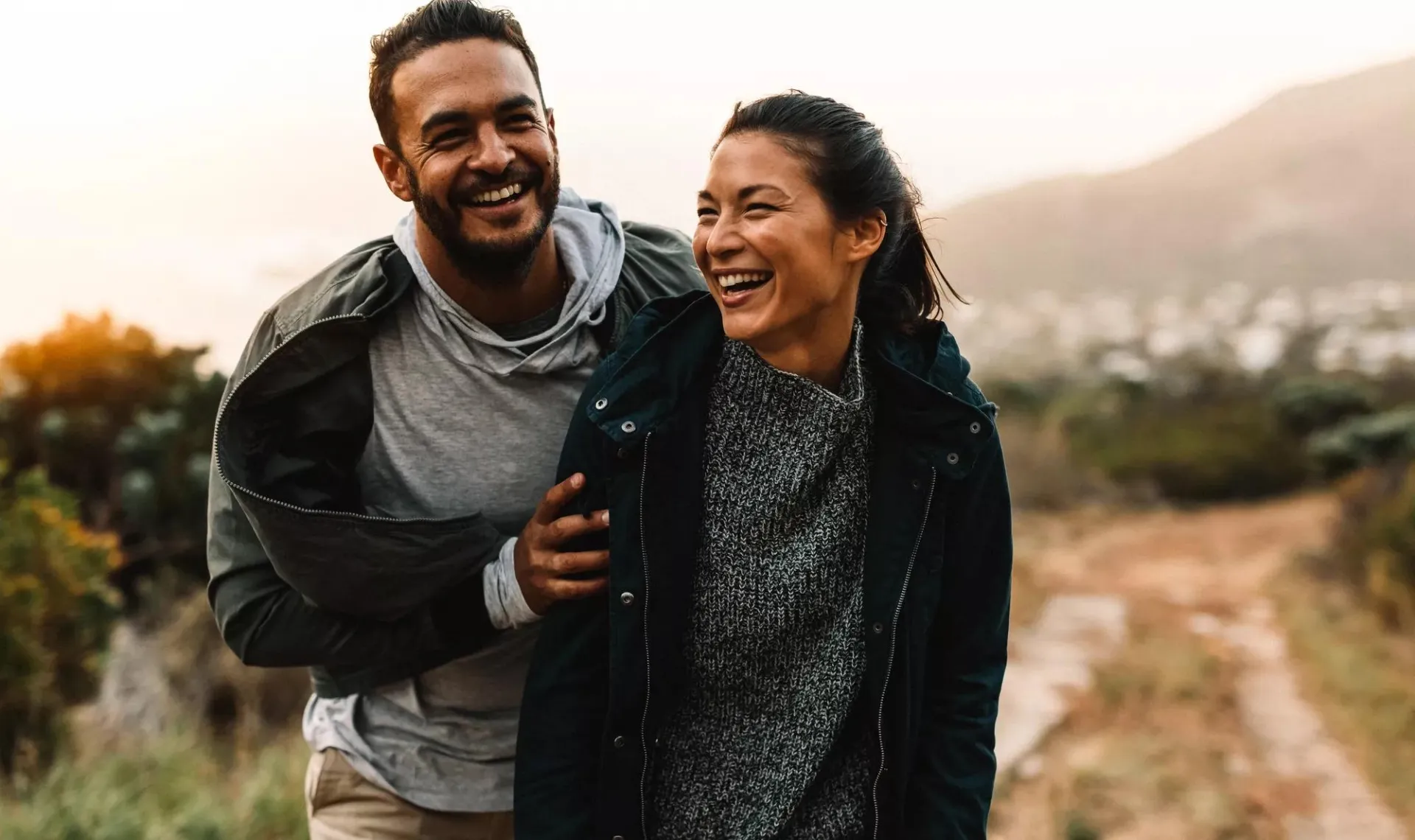 Man and woman walking outdoors.